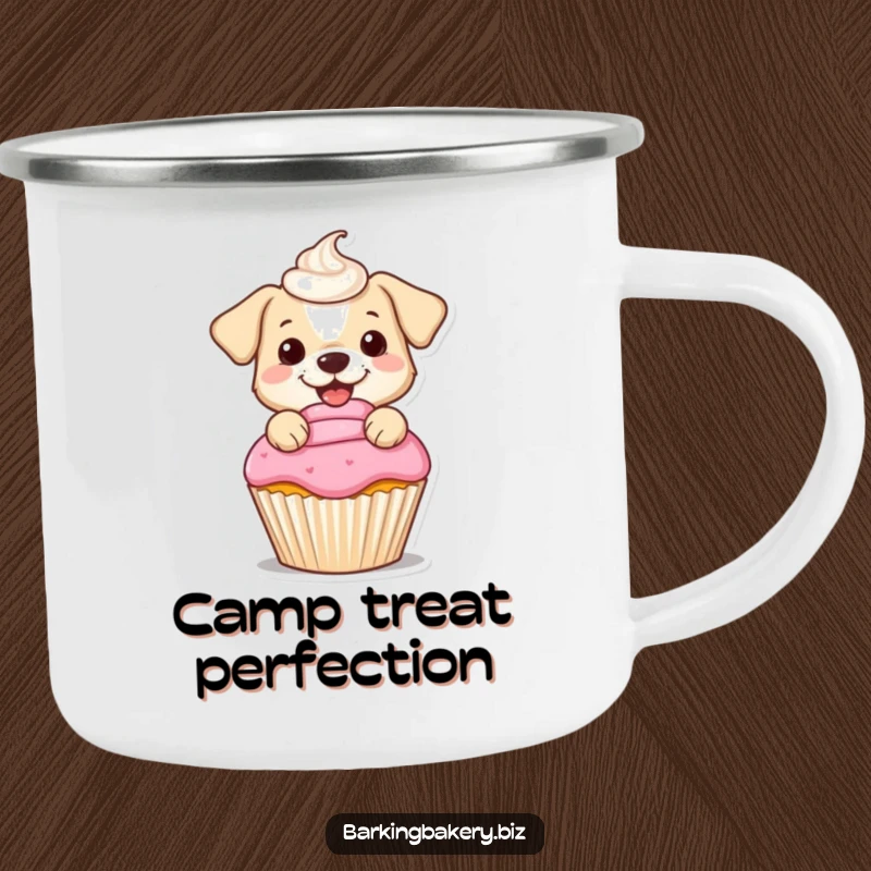 Funny camping mug of a small dog happily frosting a cupcake with a swirled dollop, great for festive outdoor enjoyment.