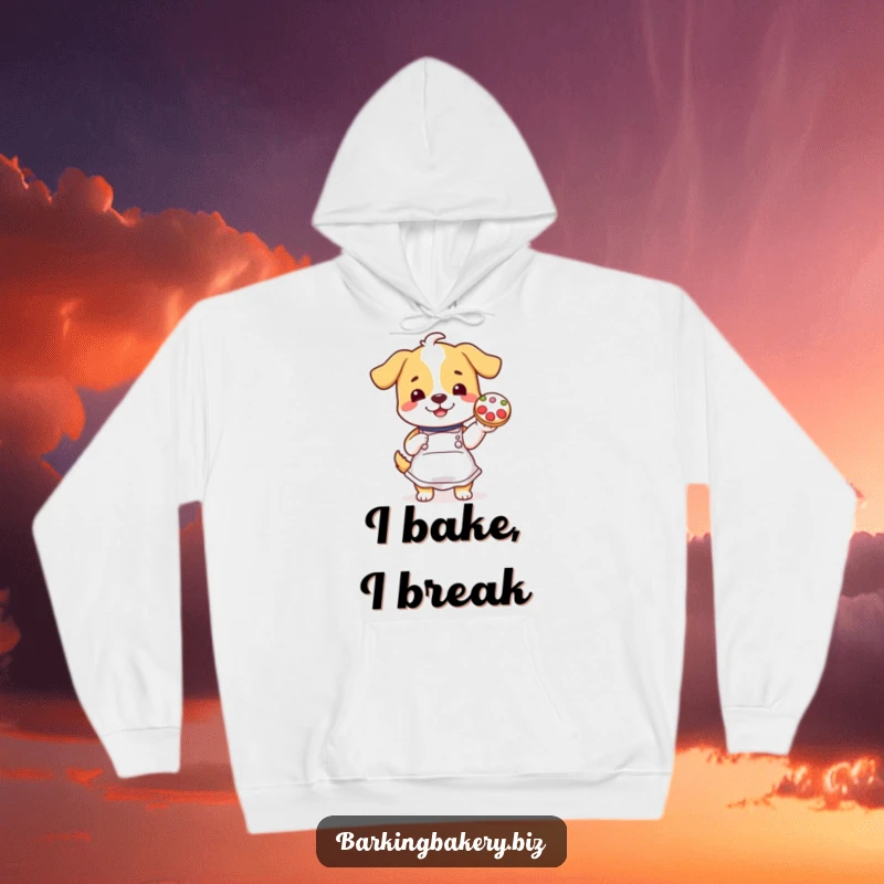 Funny dog in apron proudly displays a decorated cookie, creating a cozy and humorous hoodie design.