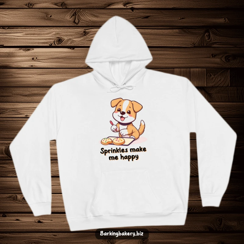 Funny Hoodie: A dog wagging its tail happily decorates cookies with sprinkles, offering warmth and humorous baking comfort.