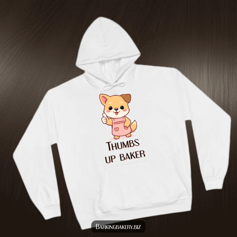 Funny dog hoodie depicting a cute puppy wearing a small apron and giving a positive thumbs up gesture, ready to cook.