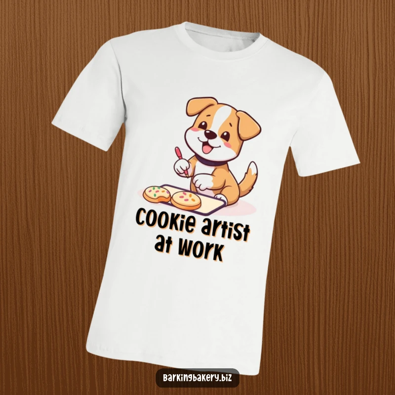 Funny T-Shirt: A dog wagging its tail happily decorates cookies with sprinkles, showcasing a joyful and sweet baking moment.