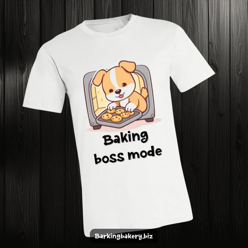 Funny dog t-shirt, a cute puppy chef slides a tray of cookies from a tiny oven with a determined expression, perfect for bakers.