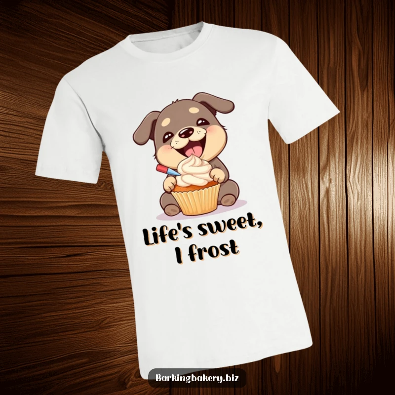 Funny dog t-shirt showing a gleeful dog with a huge smile, happily applying frosting to a cupcake, a dessert master.