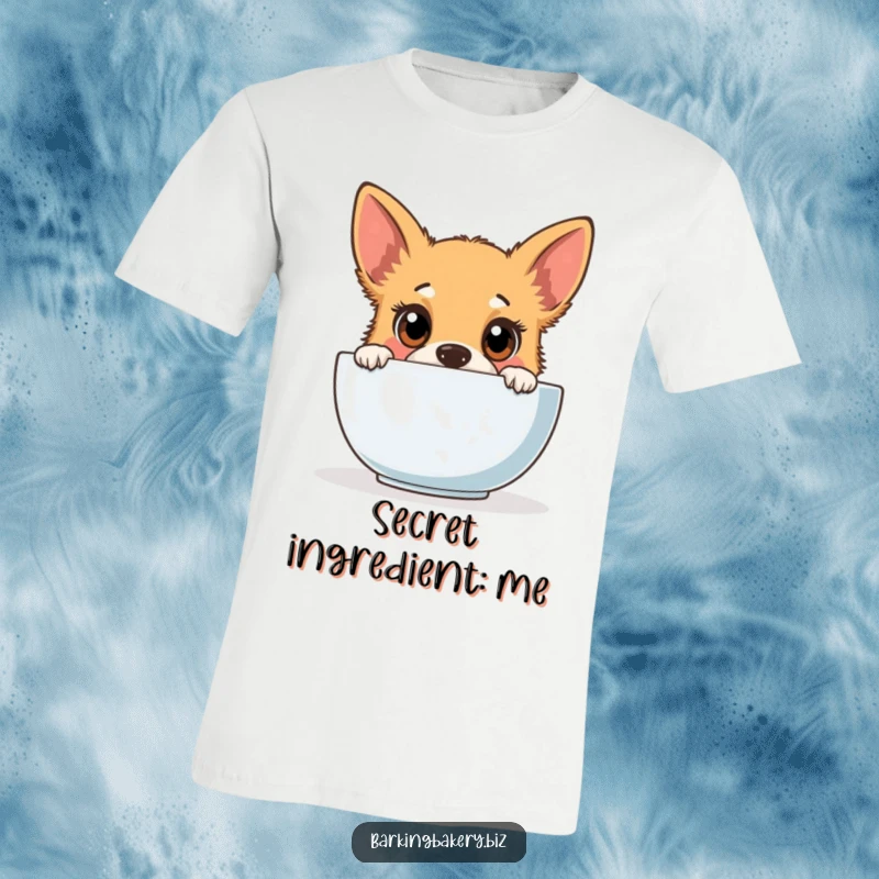 Funny dog t-shirt featuring a cute puppy with wide, curious eyes peeking into a mixing bowl, ready for baking fun.