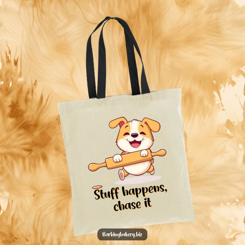 Funny Tote Bag: A dog with a grin playfully chases a rolling pin, perfect for carrying essentials with humorous flair.