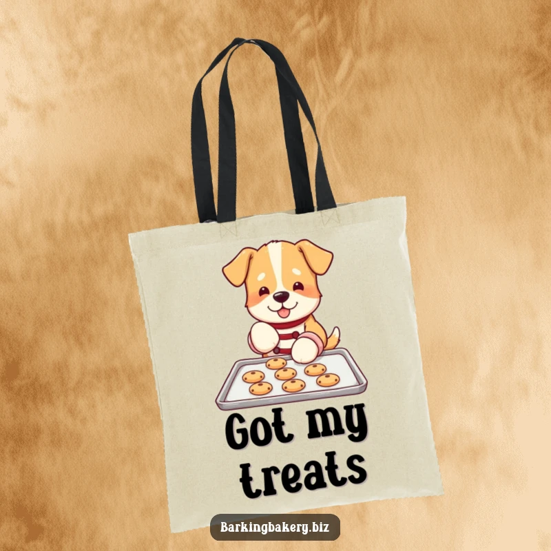 Funny dog tote bag with an image of a dog in oven mitts, carefully placing cookies on a baking sheet, a baker's essential.