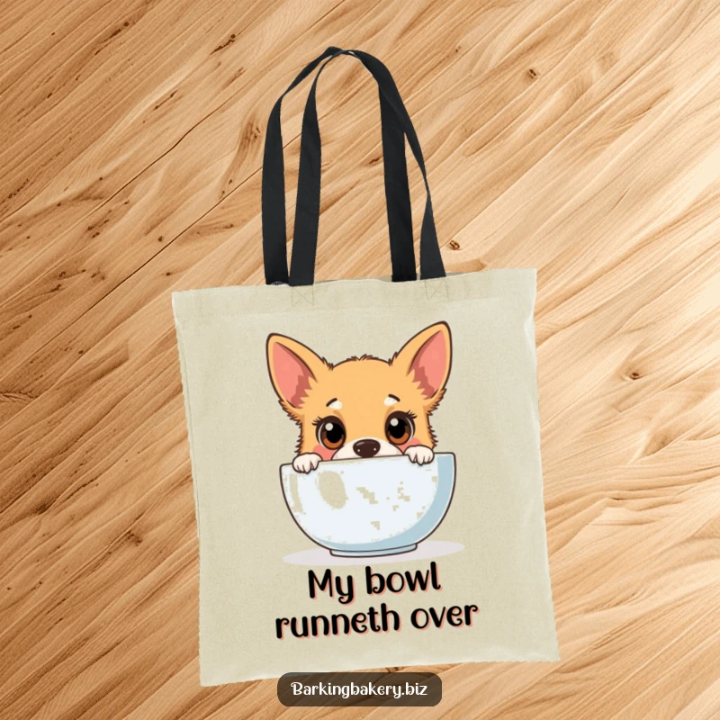 Funny dog tote bag showing a cute puppy peeking into a mixing bowl with an expression of pure baking curiosity.